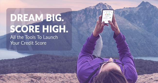 dream big. score high. all the tools to launch your credit score, person on a plateau in front of a mountain looking at their phone.