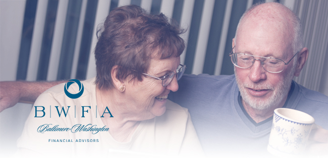 Two people smiling. One has a mug. BWFA logo in the bottom left corner