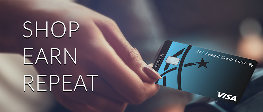 shop earn repeat. a hand holding an apl fcu rewards card