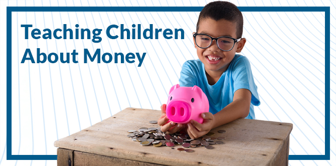 child holding a piggy bank with coins on table. teaching children about money text
